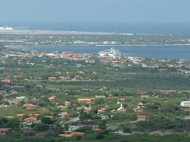 A view of the island with a small ship.