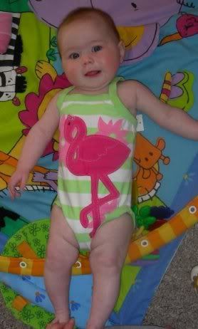 This bathing suit is a 12-18mth size, Kedron is 5 mths old... She is a very long girl, she should slow down though, the boys were the same.