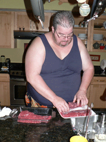 Patrick preparing his meat