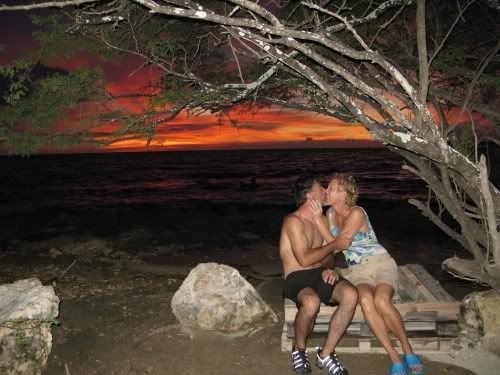 Kenny and Kristi K-I-S-S-I-N-G...UNDER (close enough) a Bonaire tree...hehe